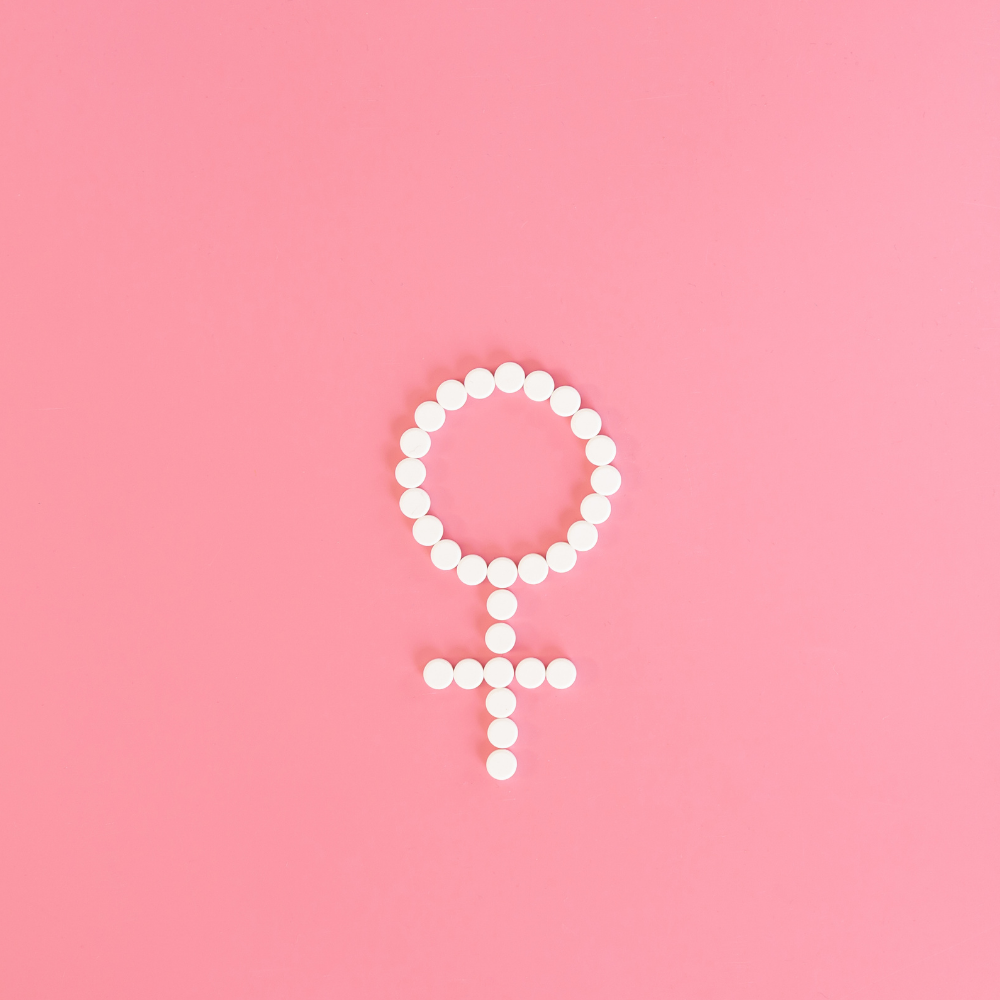 SUPLUS Feminine Vitality collection image with pink supplement bottles on a white background