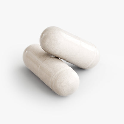 Close-up of SUPLUS 5 HTP white capsules on a clean white surface